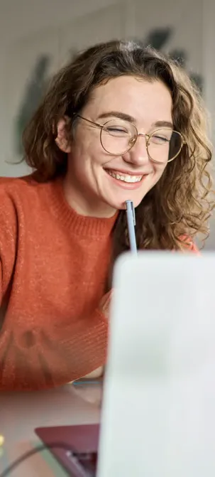 Girl at computer, smiling